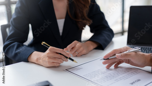 Professional Woman Ready for Job Interview. Businesswoman Applying with Resume for Recruitment and Hiring. Successful Job Interview. Confident Female Applicant Presenting Resume to Employer.