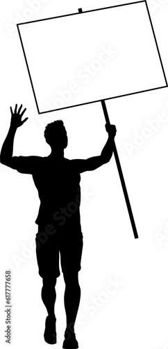 Protestor or demonstrator at a demonstration march, picket line or strike protest rally in silhouette. Holding up a banner or picket sign board placard.