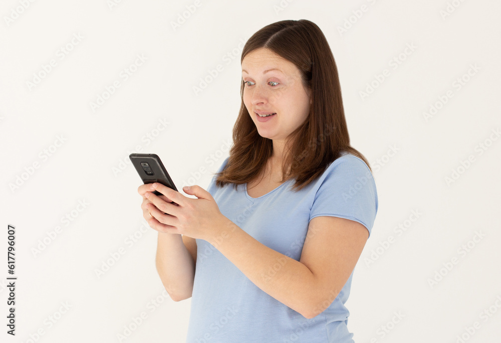 Portrait of attractive focused cheerful pregnant girl using device app chatting isolated over white color background Portrait of attractive focused cheerful pregnant girl using device app chatting isolated over white color background