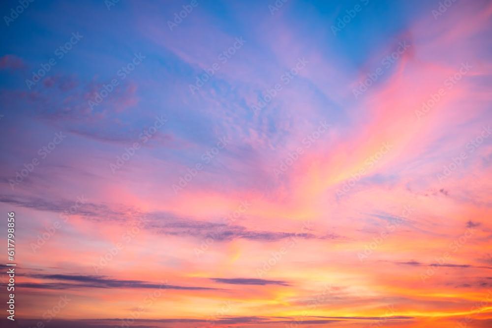 Obraz premium beautiful , luxury soft gradient orange gold clouds and sunlight on the blue sky perfect for the background, take in everning,Twilight