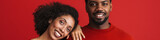Black happy man and woman smiling and looking at camera