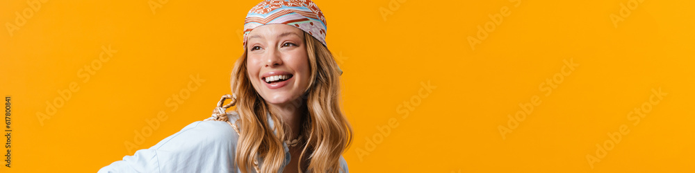 Young puzzled woman wearing bandanna using cellphone Young puzzled woman wearing bandanna using cellphone