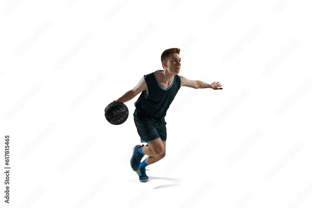 Dynamic image of young man, athlete running with ball, playing basketball isolated against white background. Concept of sport, action and motion, health, game, hobby, sportswear, ad