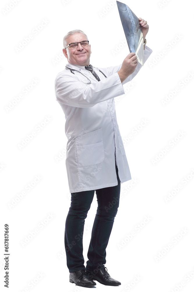 in full growth. smiling male therapist with an x -ray . in full growth. smiling male therapist with an x -ray .