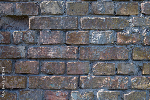 Texture of an old brown brick wall