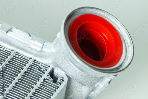 New car radiator car stove on a white background, close-up photo