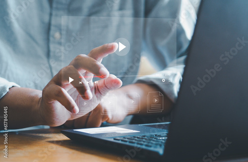 Businessman touching a virtual screen with his hands for online streaming watch videos on the internet online webinars internet education e-learning concept photo