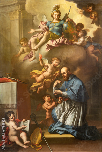 GENOVA, ITALY - MARCH 7, 2023: The painting of St. Francis de Sales and St. Michael archangel in the church Santuario di San Franceso da Paola by Francesco Campora (1693 - 1763). photo