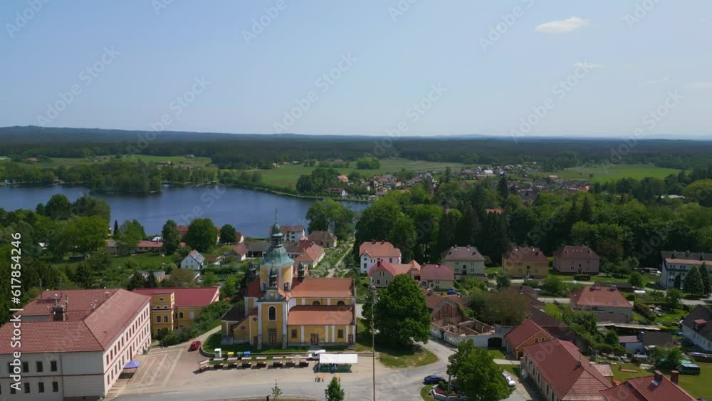 Church lake village Chlum in czech republic. Perfect aerial top view flightdrone Church lake village Chlum in czech republic. Perfect aerial top view flightdrone