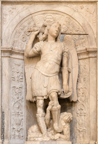NAPLES, ITALY - APRIL 21, 2023: The marble relief of Michael Archangel in the church Basilica di San Pietro ad Aram by Bartolom Ordonez from 16. cent.