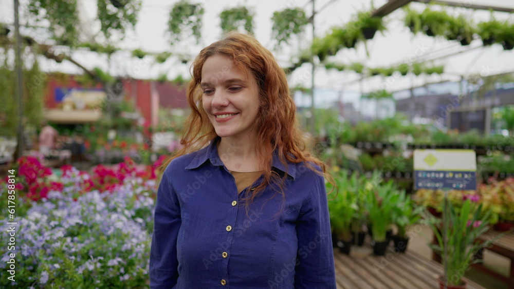 Happy Woman Strolling Through Flower Shop Isle at Local Retail Business Happy Woman Strolling Through Flower Shop Isle at Local Retail Business