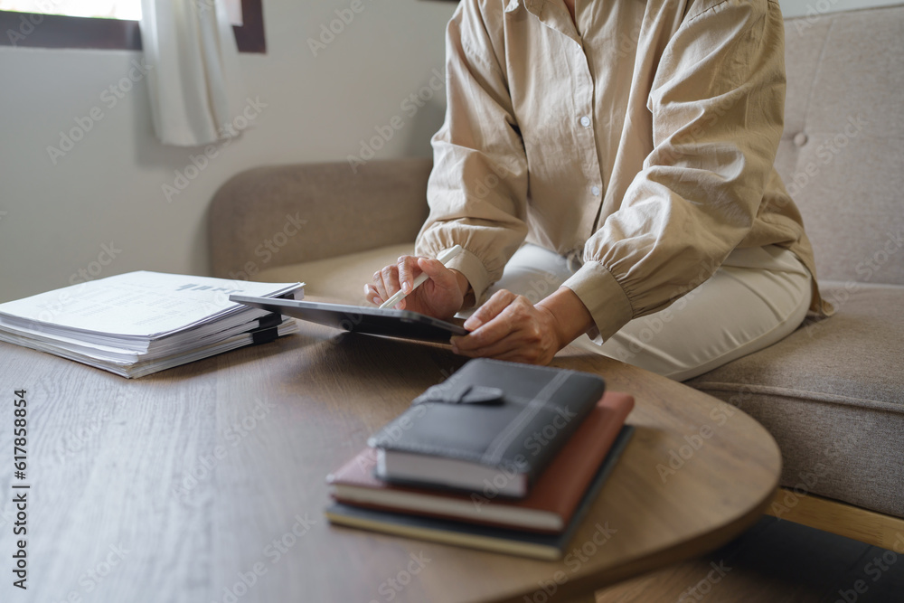 Fototapeta premium Image of woman calculate tax invoice at home, summarizing taxes, money planing..
