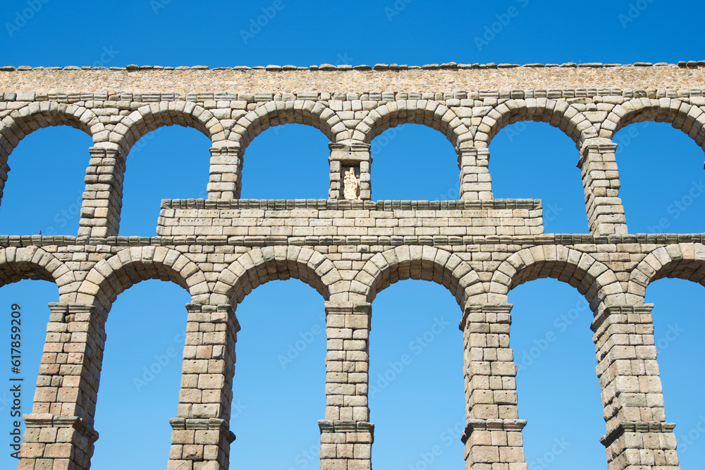 View of the Roman aqueduct in the city of Segovia, Castilla Leon in Spain. View of the Roman aqueduct in the city of Segovia, Castilla Leon in Spain.