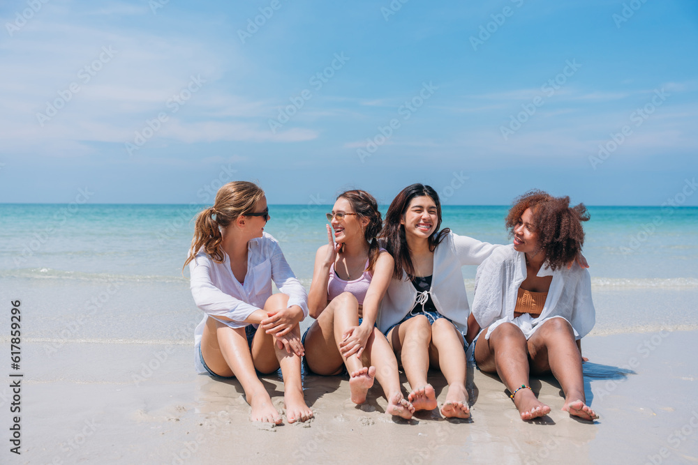 Happy children laughing and enjoying at beach. Teenage playing with friends at the sea. Vacations time and friendship concept. Happy children laughing and enjoying at beach. Teenage playing with friends at the sea. Vacations time and friendship concept.