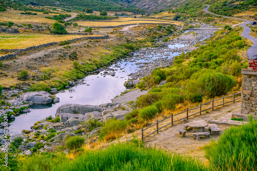 Panoramic of the Barbellido river with its round stones from the El Mellizo refuge area in the Sierra de Gredos photo