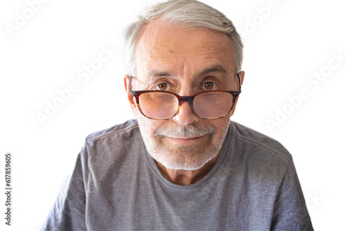 Close-up portrait of an unshaven old man in glasses, looking into the lens, isolated, on a white background.