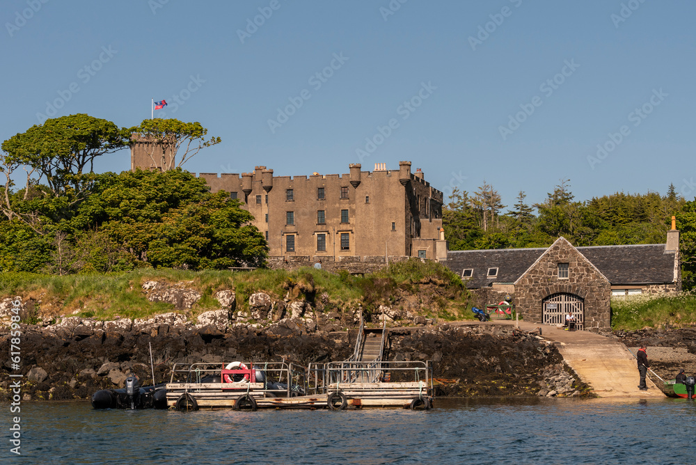 Dunvegan, Isle of Skye, Scotland, UK. June 6 2023. Dunvegan Castle landing stage and gardens seen from Loch Dunvegan in the Scottish isles. . Dunvegan, Isle of Skye, Scotland, UK. June 6 2023. Dunvegan Castle landing stage and gardens seen from Loch Dunvegan in the Scottish isles. .