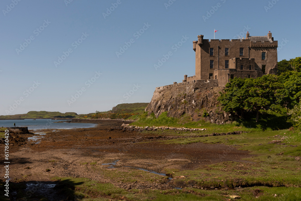 Dunvegan, Isle of Skye, Scotland, UK.  June 6 2023.  Dunvegan Castle viewed at low tide ,famous home of the Clan Macleod for 800 years