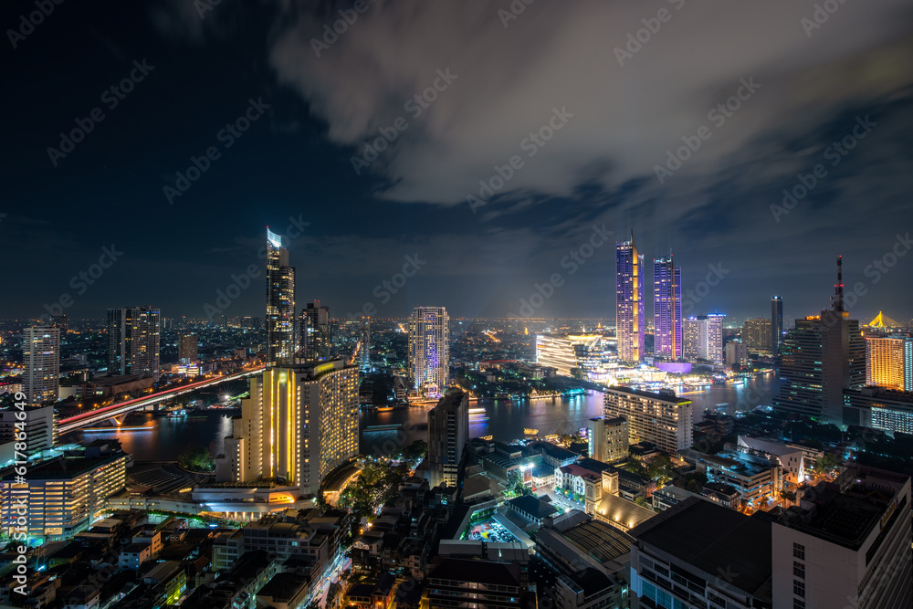 Aerial view of Bangkok skyline and skyscraper in Bangkok downtown. Panorama  over Chao Phraya River Bangkok Thailand at sunset.