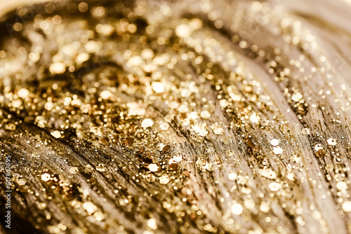 Shiny gold glittering background with soft selective focus. photo