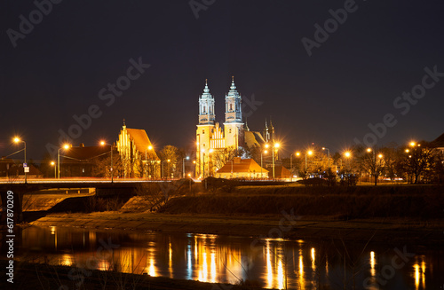 bridge over the river Warta and gothic cathedral at night in Poznan i
