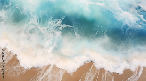 Satellite view of a beach with blue water, white waves and golden sand