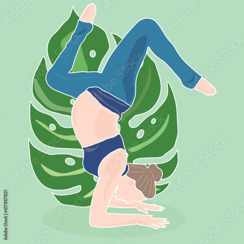 Pregnant girl is doing yoga. The expectant mother goes in for sports. Sports, yoga, pilates, motherhood, child