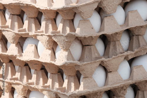 Chicken white eggs in paper packaging. The concept of a farmer's market, a dietary product.