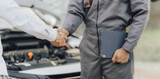 The male mechanic's hand holds the wrench Are showing solidarity with colleagues , Concept of engineer and auto repair