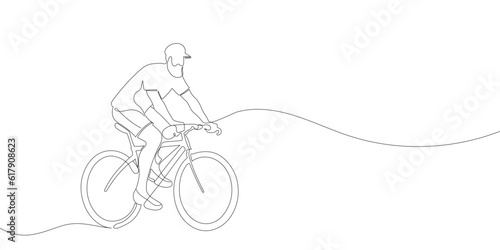 Fototapeta Naklejka Na Ścianę i Meble -  A cyclist or cyclist rides down the street. continuous one line drawing of sports man. Vector illustration