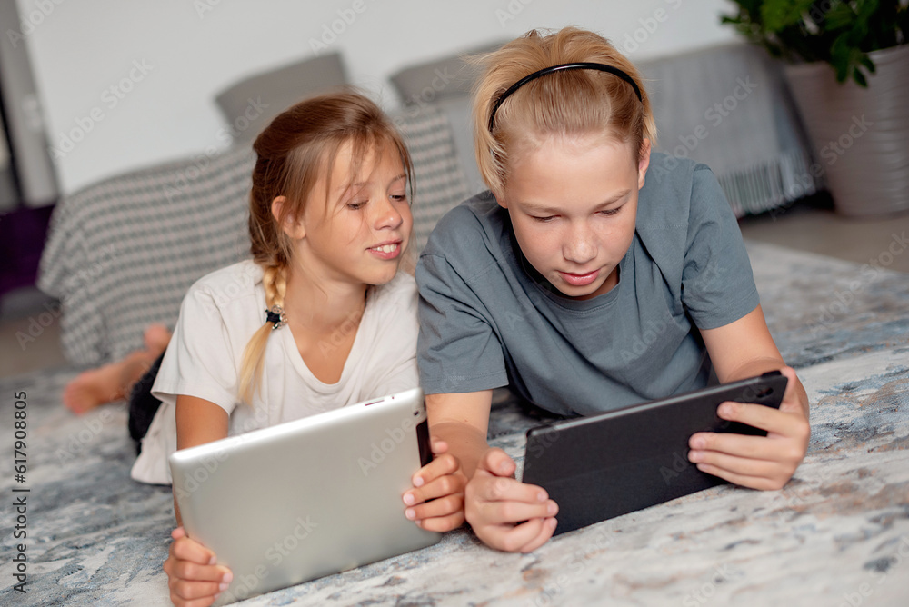 Kids using a digital tablet Kids using a digital tablet