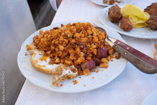 migas tradicionales en chinchon madrid migas con huevos y uvas photo