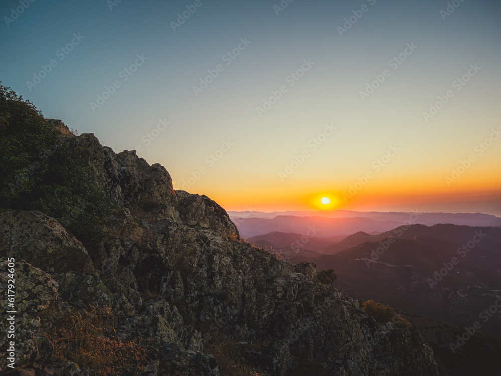 Through the mountains I see a sunset on the top of a mountain in Cyprus Through the mountains I see a sunset on the top of a mountain in Cyprus