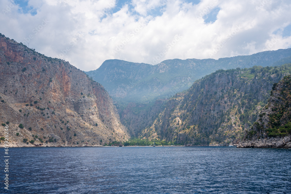 View from water of Butterfly Valley in Oludeniz Fethiye in the morning, Turkey