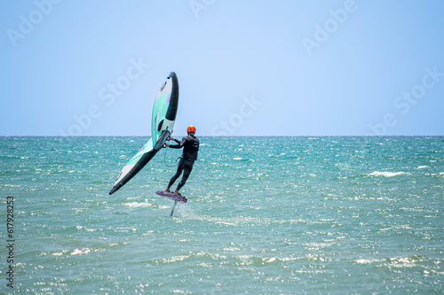 Surfers on beach in Torremolinos, Spain on May 28, 2023