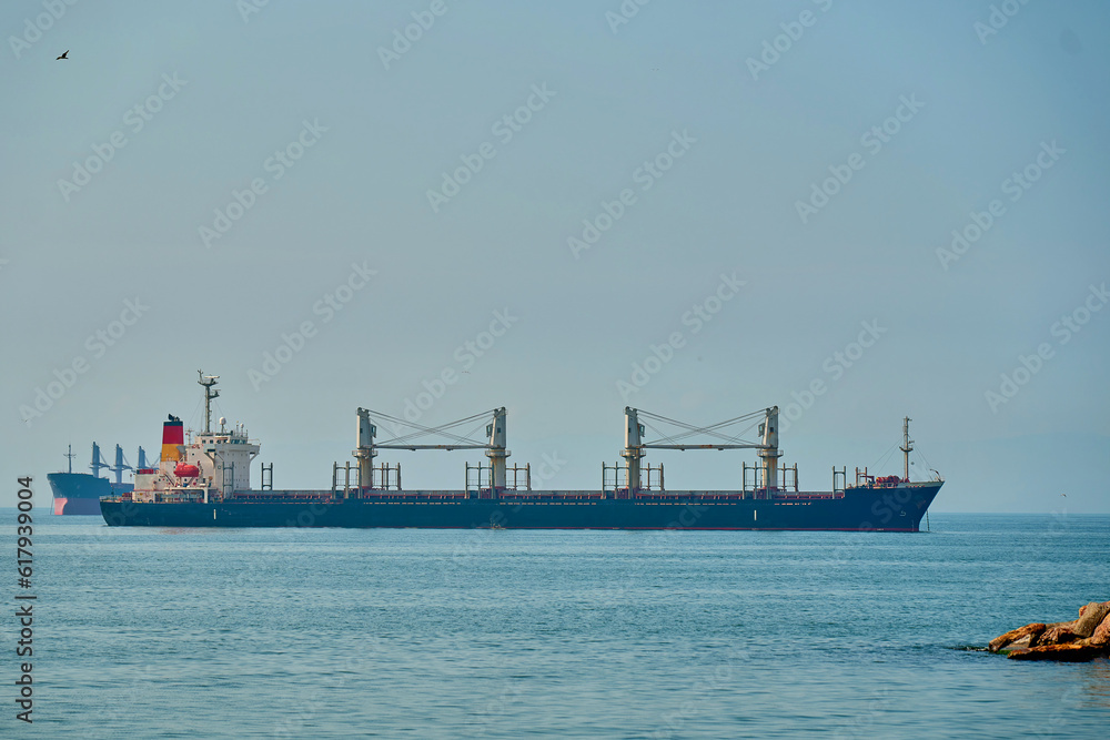 cargo ship passes through the strait
