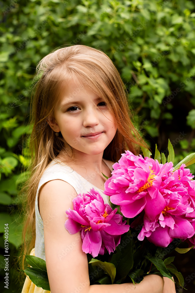 a beautiful blonde girl with long hair holds a bouquet of pink peonies in her hands a beautiful blonde girl with long hair holds a bouquet of pink peonies in her hands