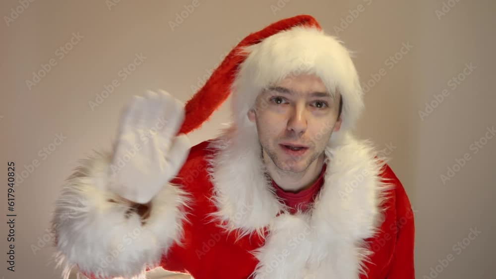 Portrait of funny Santa Claus looking and congratulates on camera. Concept of Christmas holidays and celebrations. Portrait of funny Santa Claus looking and congratulates on camera. Concept of Christmas holidays and celebrations.