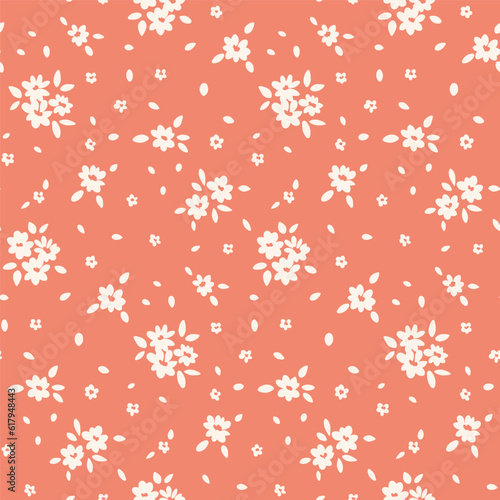 Seamless floral pattern, liberty ditsy print of mini cute flowers in two colors. Pretty rustic botanical design: small hand drawn flowers, tiny leaves on a gentle pink background. Vector illustration.