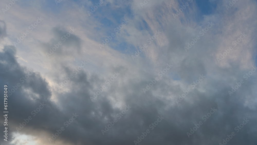 Obraz premium A terrible black cloud hangs in the sky before the rain. Bad weather. Hurricane and thunder over the city. Climate change and natural disasters. Bad mood and despondency.