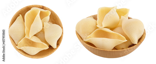 Conchiglioni italian pasta in wooden bowl isolated on white background. Top view. Flat lay