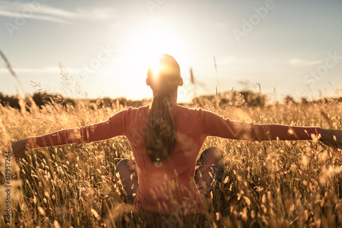 Morning Sunlight over a Rural Farm Landscape with a Young Adult Woman Enjoying Nature