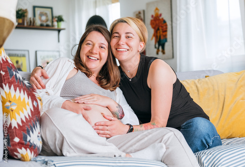 Картината върху платно Happy smiling women couple waiting for baby