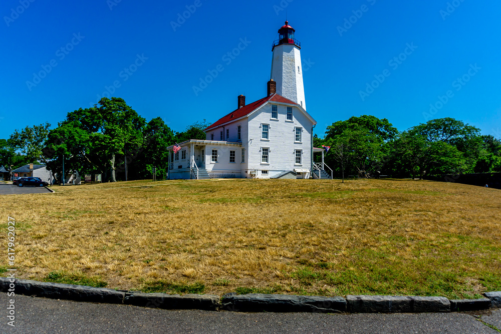 The Sandy Hook Lighthouse, situated in New Jersey, United States, is a historic maritime landmark. Its rich architectural heritage and panoramic views of the Atlantic Ocean makes it a nautical gem.