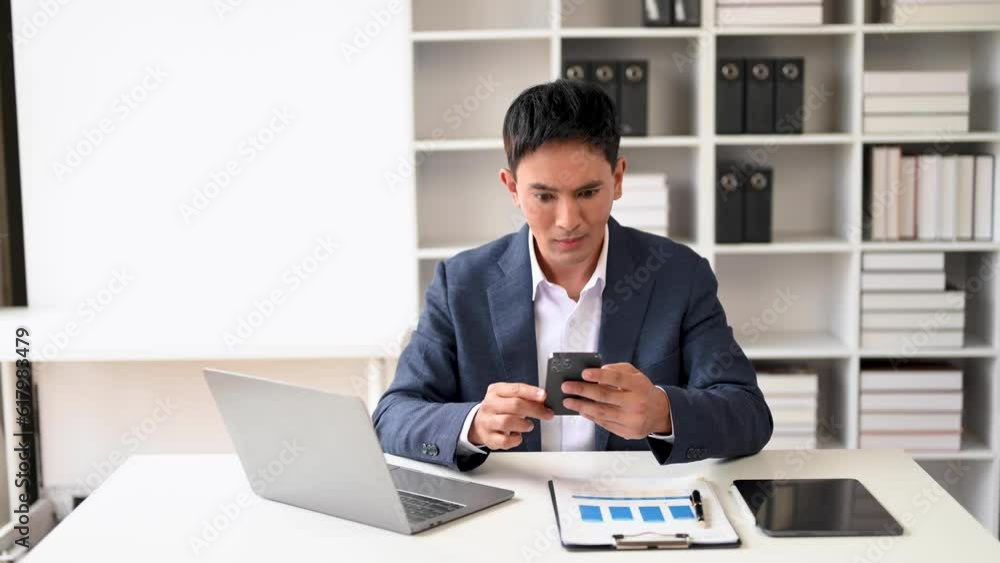Asian business man are delighted and happy with the work they do on their tablet, laptop and taking notes at the modern office. Asian business man are delighted and happy with the work they do on their tablet, laptop and taking notes at the modern office.
