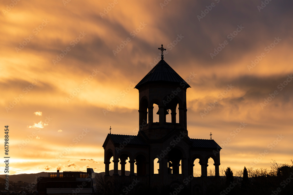 Silhouette of the bell tower. Sunset. Tbilisi