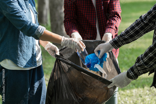 A team of volunteers helped collect rubbish in black bags. Grab a water bottle, a plastic bag, and a Styrofoam box. clean the area environmental protection Reduce heat illness, save the world concept