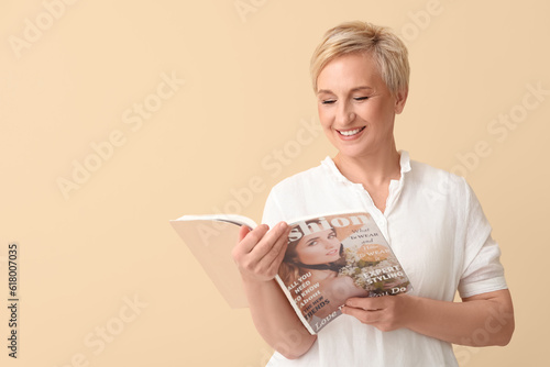 Mature woman reading magazi...