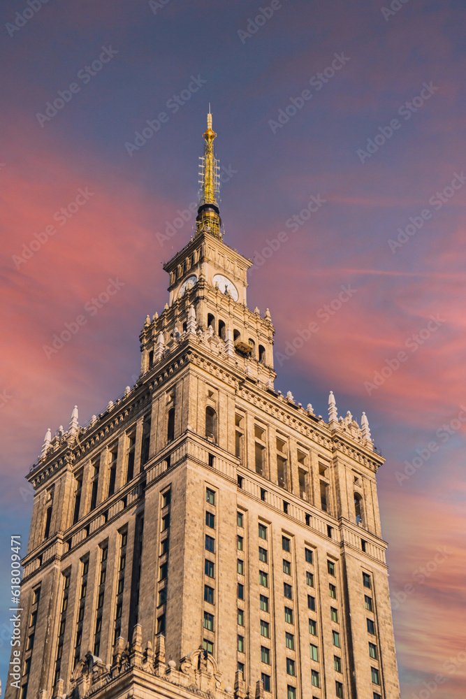 The Palace of Culture and Science Beautiful architecture of Warszawa city center with Palace of Culture at sky background. One of the main symbols of Warsaw skyline. Travel destinations tourist The Palace of Culture and Science Beautiful architecture of Warszawa city center with Palace of Culture at sky background. One of the main symbols of Warsaw skyline. Travel destinations tourist