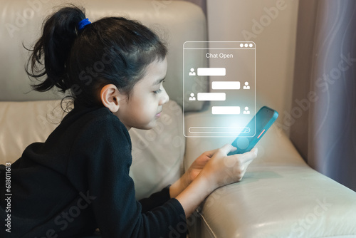 Children girl using smartphone chatting social communication networking online. contact service application. digital contact information.